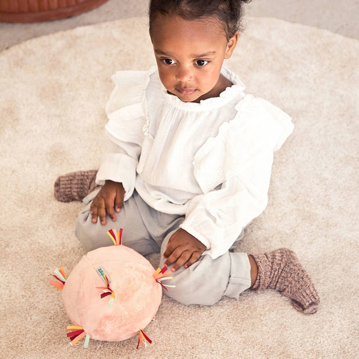 Pluszowa piłka sensoryczna z pozytywką wielofunkcyjna Sarenka Stella Lilliputiens