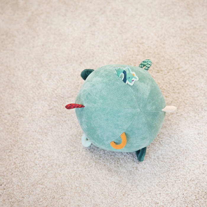 Pluszowa piłka sensoryczna z pozytywką wielofunkcyjna Smok Joe Lilliputiens