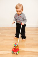 Drewniana zabawka do pchania na kijku, pchacz Karuzela, BAJO