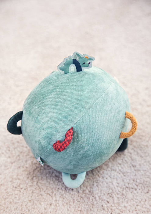 Pluszowa piłka sensoryczna z pozytywką wielofunkcyjna Smok Joe Lilliputiens